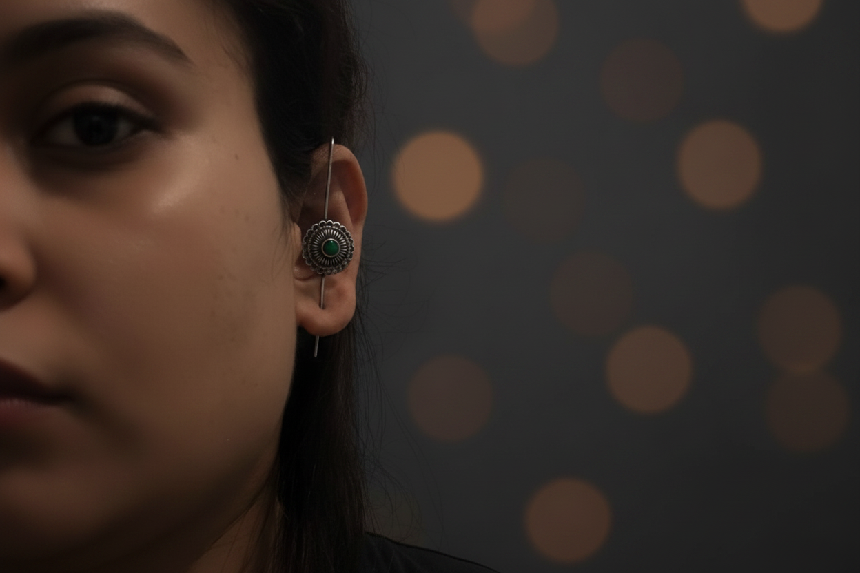 Earring with dark green stone